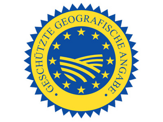 gelber Kreis mit blauer Mitte, in der Sterne und Felder dargestellt sind. Rund herum steht geschützte geografische Angabe.