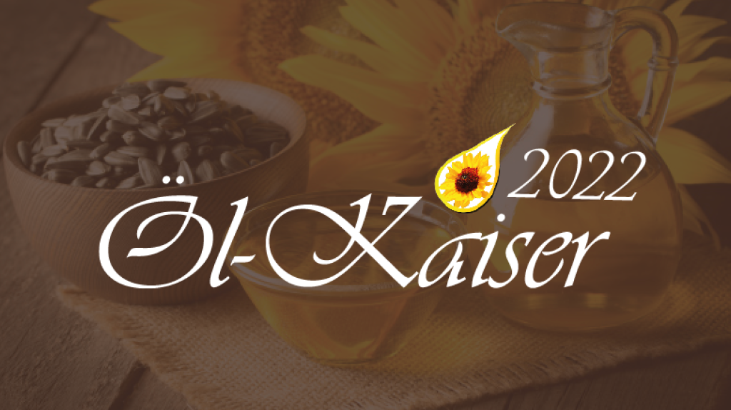 Goldener Tropfen mit gelber Sonnenblume darin und schwarzem Text darunter "Öl-Kaiser 2022"