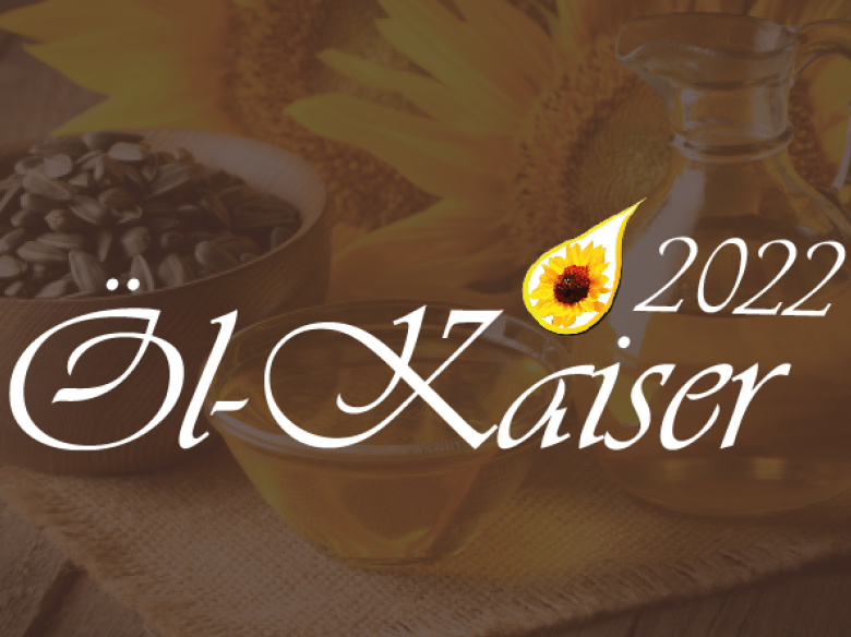 Goldener Tropfen mit gelber Sonnenblume darin und schwarzem Text darunter "Öl-Kaiser 2022"