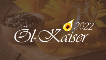 Goldener Tropfen mit gelber Sonnenblume darin und schwarzem Text darunter "Öl-Kaiser 2022"