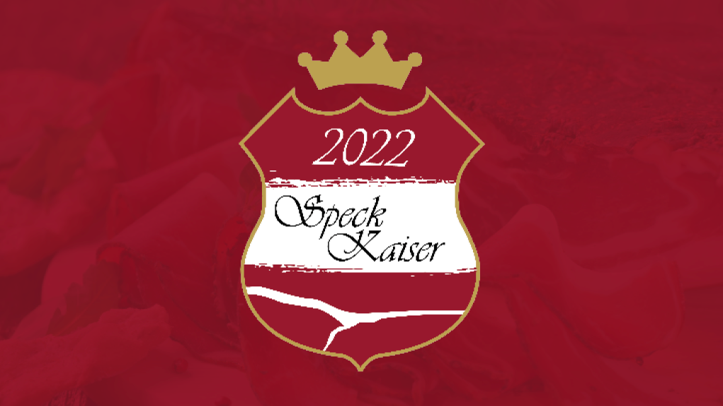 Rot-weiß-rotes Wappen mit goldener Krone darüber und Text "Speck-Kaiser 2022"