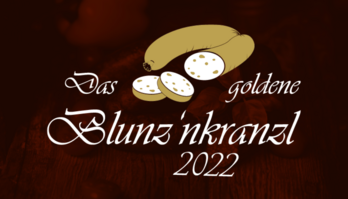 Goldene Blunze über dem schwarzen Text "Das goldene Blunz'nkranzl 2022"