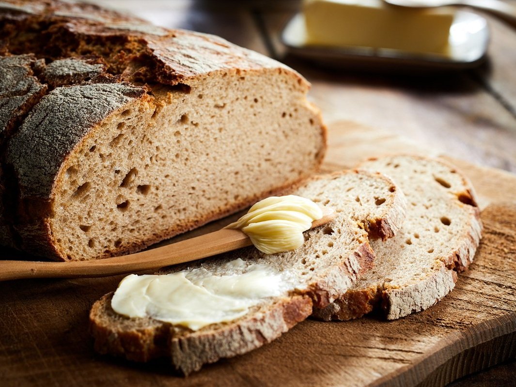 Buttered slice of freshly bake rye bread